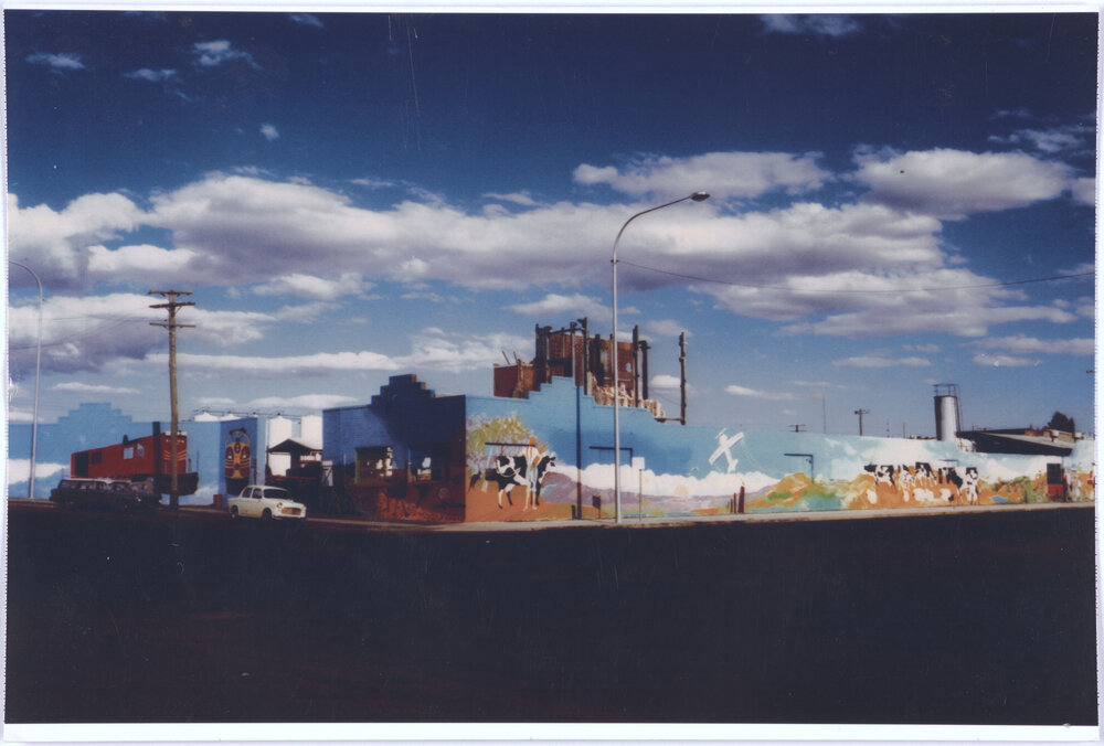 Postcard style photograph of mural on Gas Works brick wall