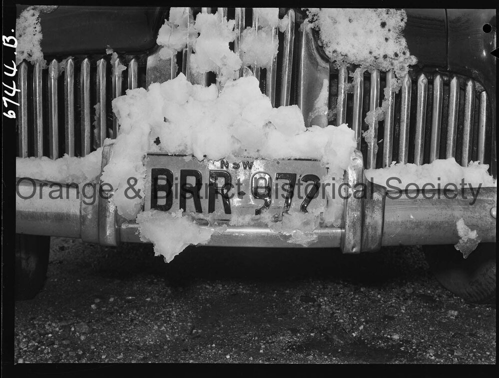 Number plate BRR 972 covered with snow