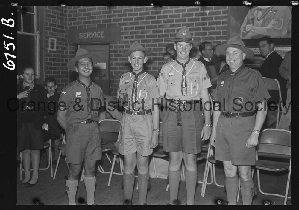 Orange boy scouts awarded with Scout Cords