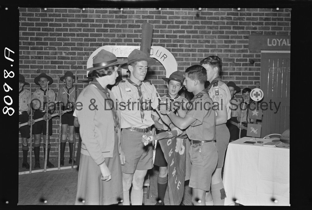 Joan Wheeler receiving Queen's badge for her brother John, who died in the Blue Mountains