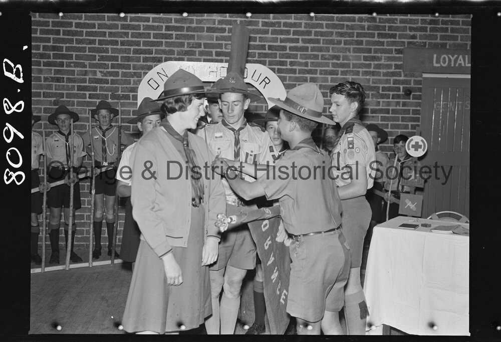 Joan Wheeler receiving Queen's badge for her brother John, who died in the Blue Mountains