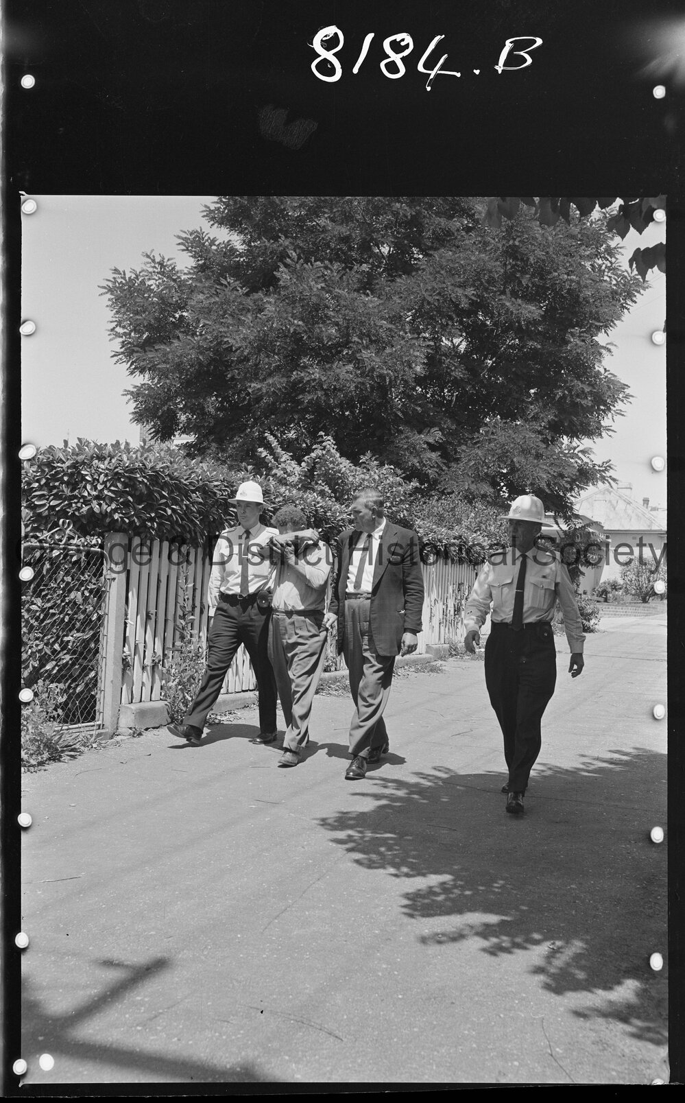 Mr Frederick Johnston being led into court to be charged with the murder of his wife