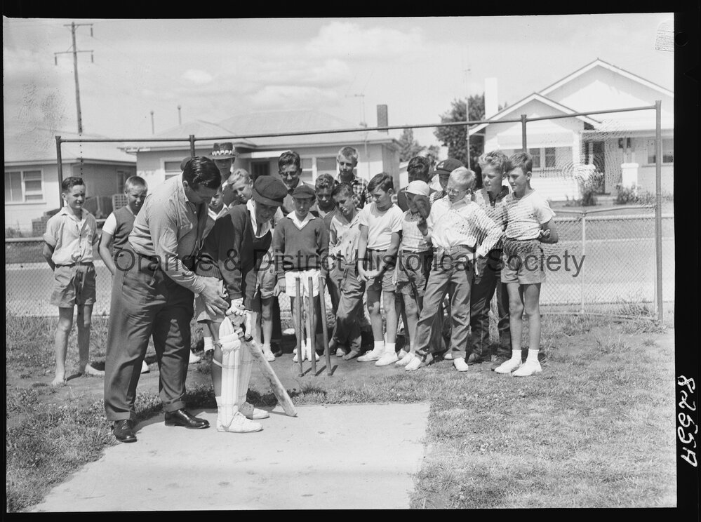 Jack Moroney coaching cricket at Orange East School