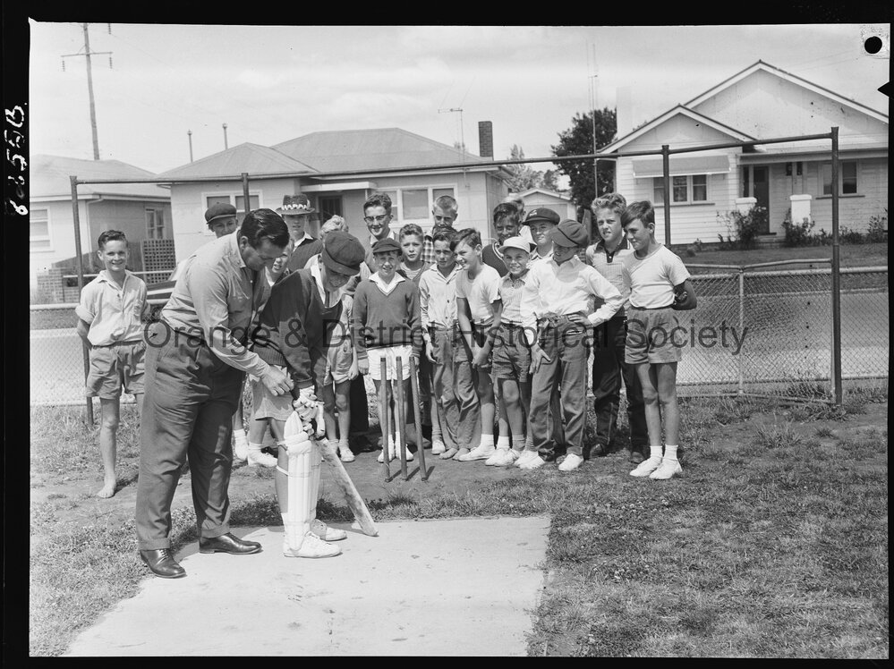 Jack Moroney coaching cricket at Orange East School