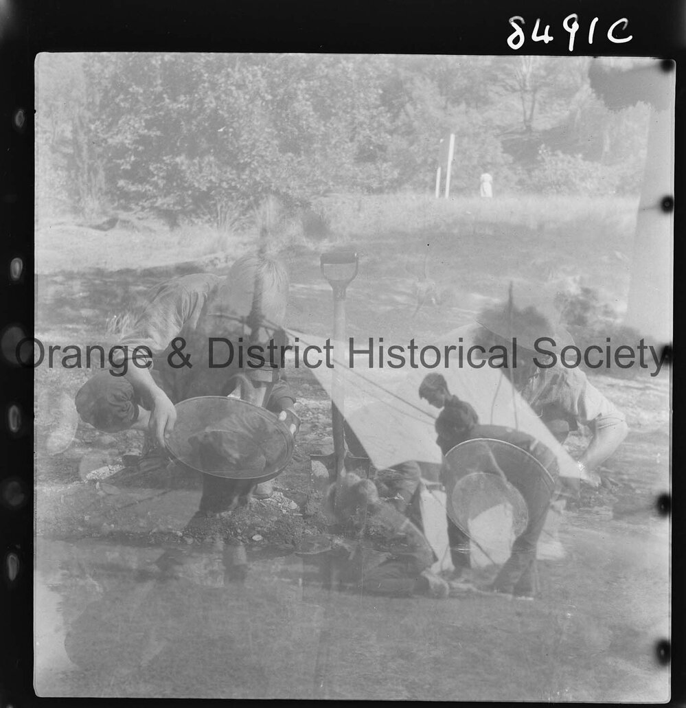 Scouts panning for gold