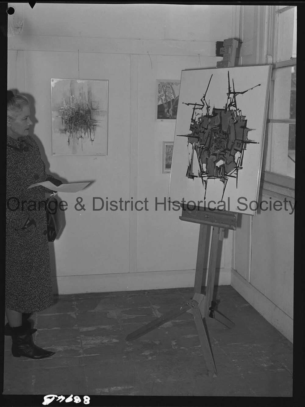 Art display, Mrs Sam Campbell studies abstract painting