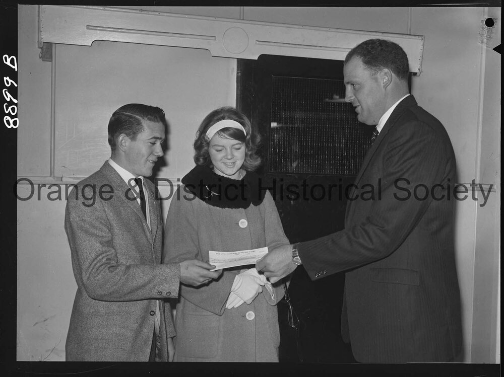 Miss Sandra Gale hands over cheque