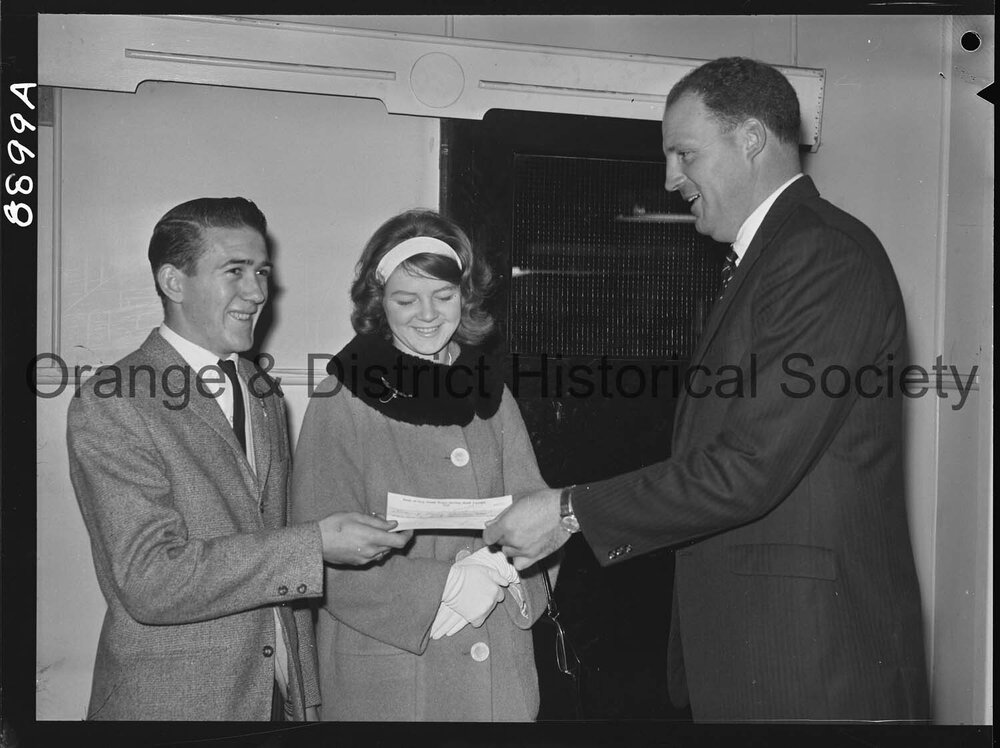 Miss Sandra Gale hands over cheque