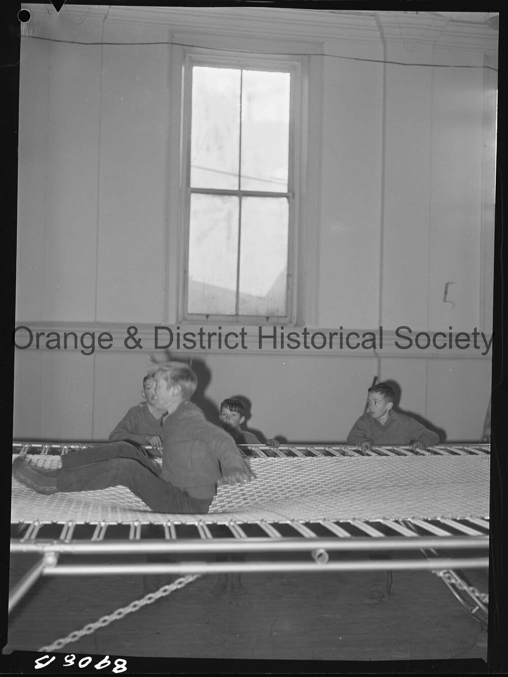 Billy Sarclat on trampoline at Police Citizens Boys' Club