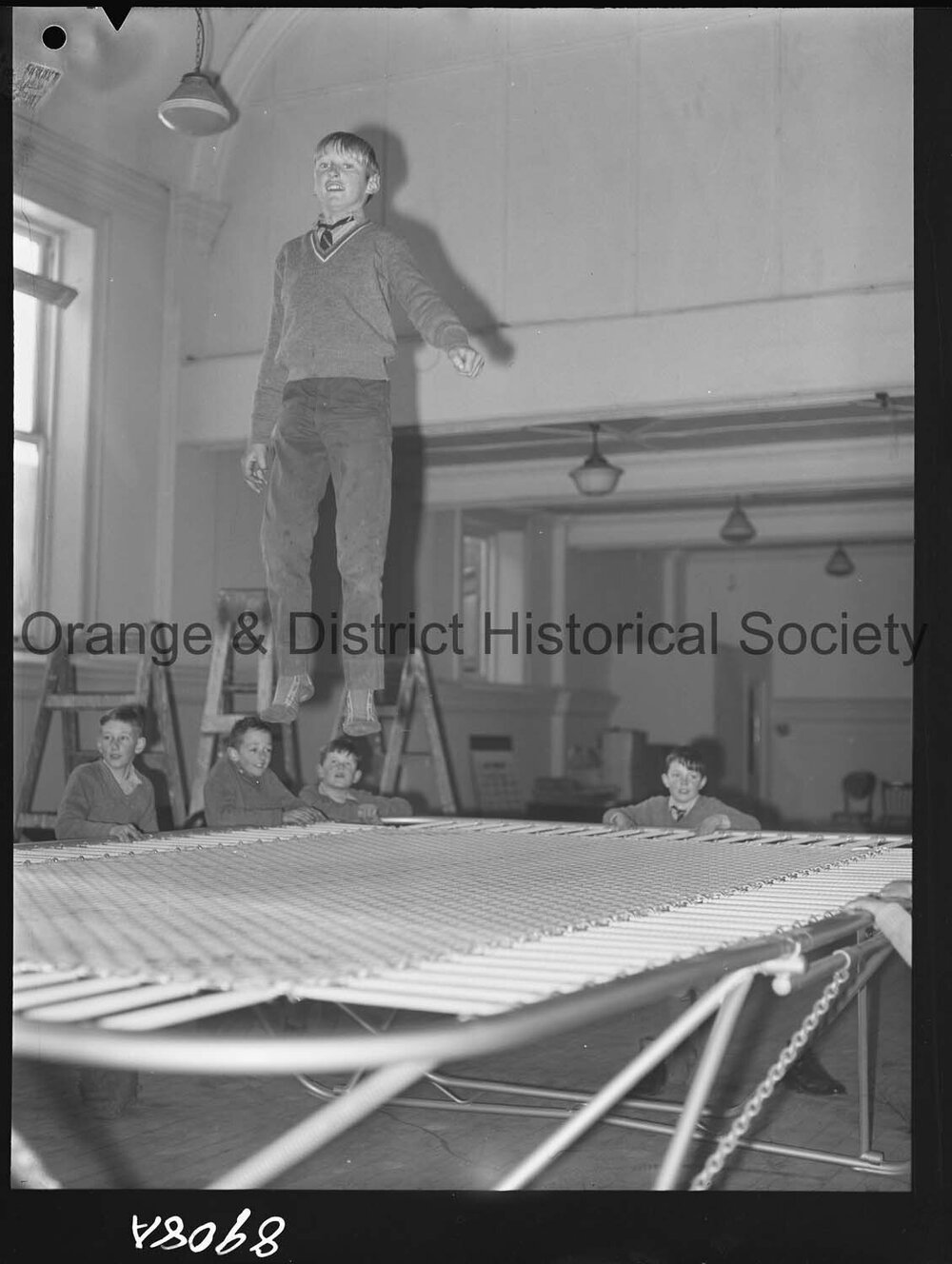 Billy Sarclat on trampoline at Police Citizens Boys' Club