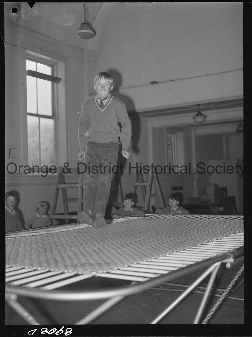 Billy Sarclat on trampoline at Police Citizens Boys' Club