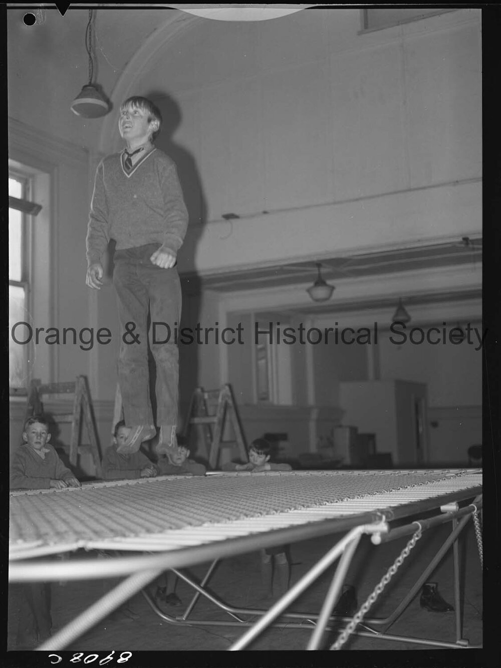 Billy Sarclat on trampoline at Police Citizens Boys' Club