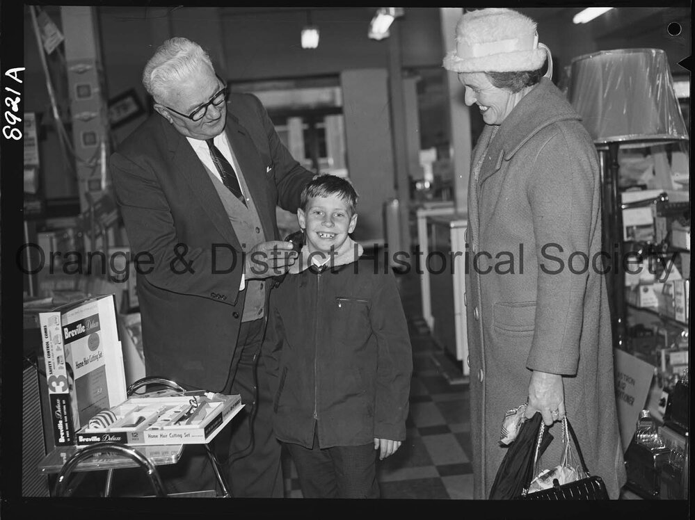 Mr R McDonald demonstrates electric hair clippers at Western Stores