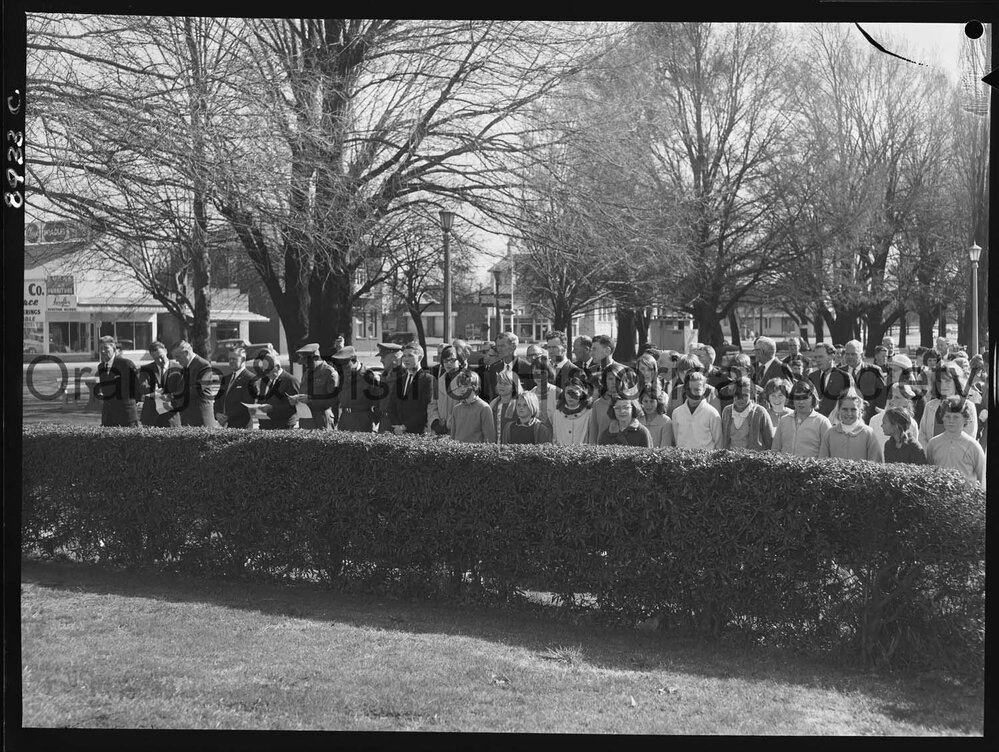 Legacy Week, people at Cenotaph watch on