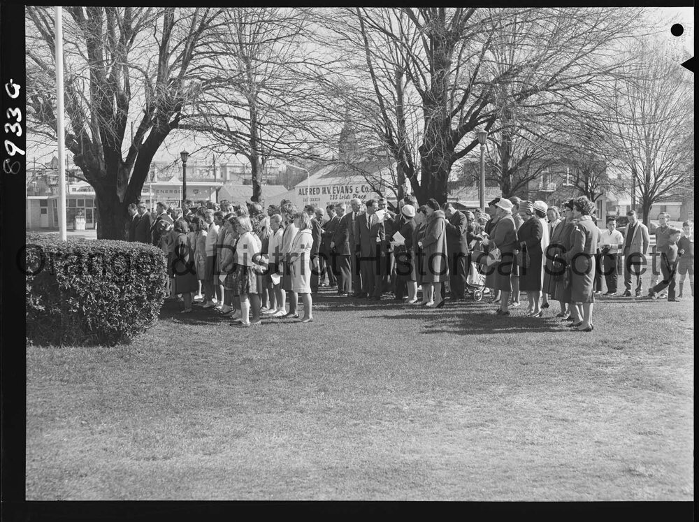 Legacy Week, people at Cenotaph watch on