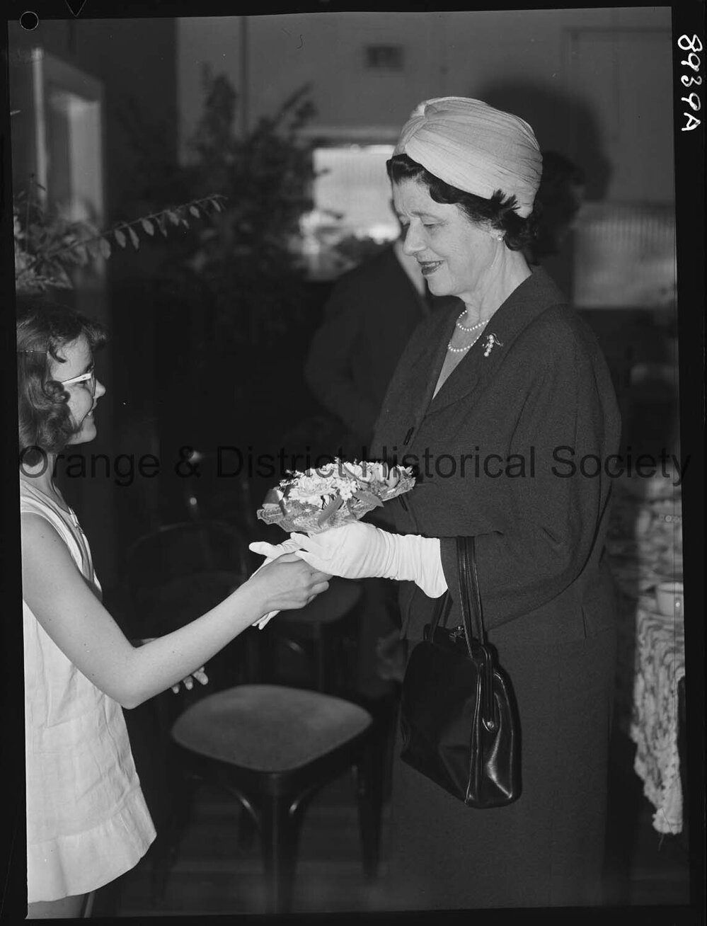 Kathleen Ratcliffe presents posy to Lady Moses