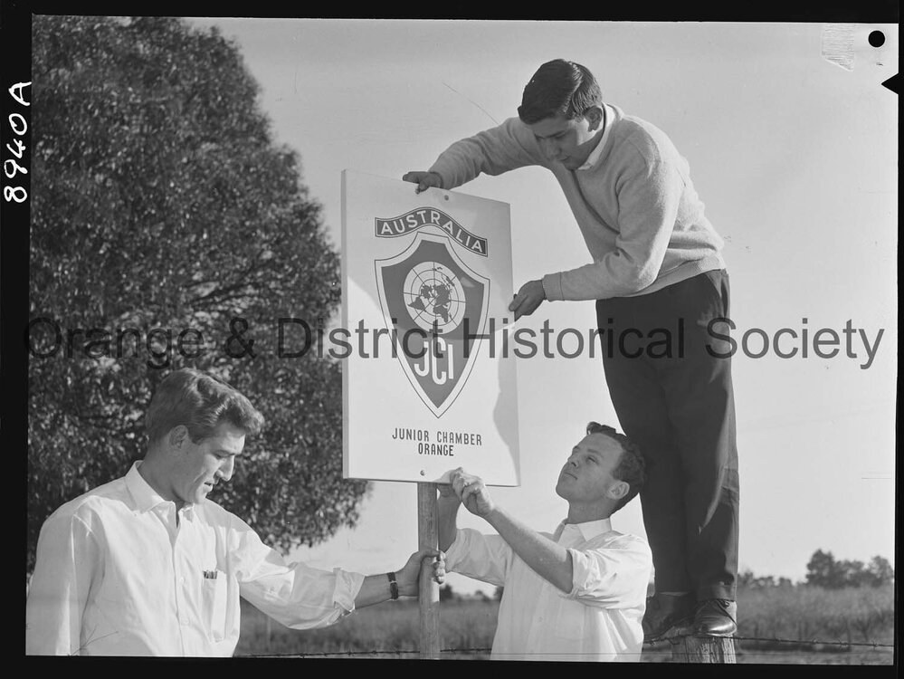 JC members erect a sign