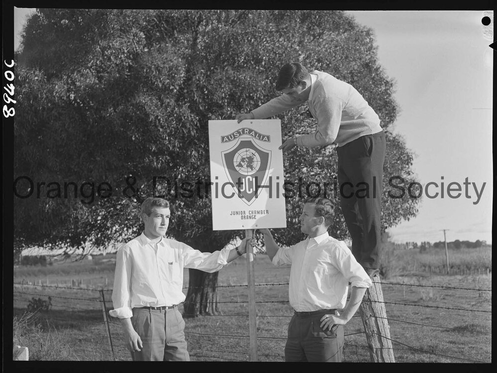 JC members erect a sign