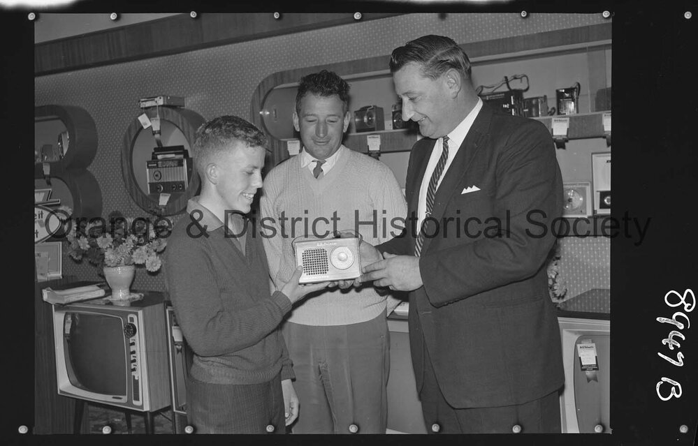 Buena Vista, Ian Oates receives transistor from Mr G Millgate, watched by Mr Bert Gallard