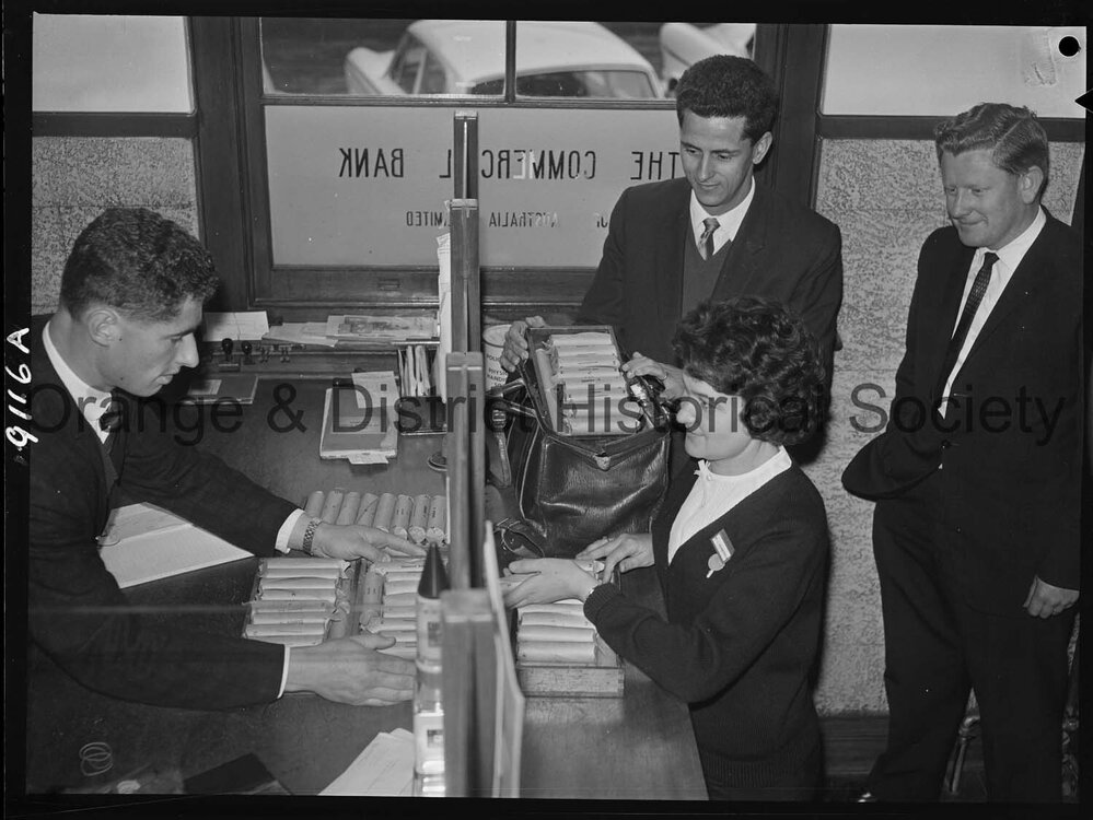 Miss Carol Nonnenmacher banking pennies