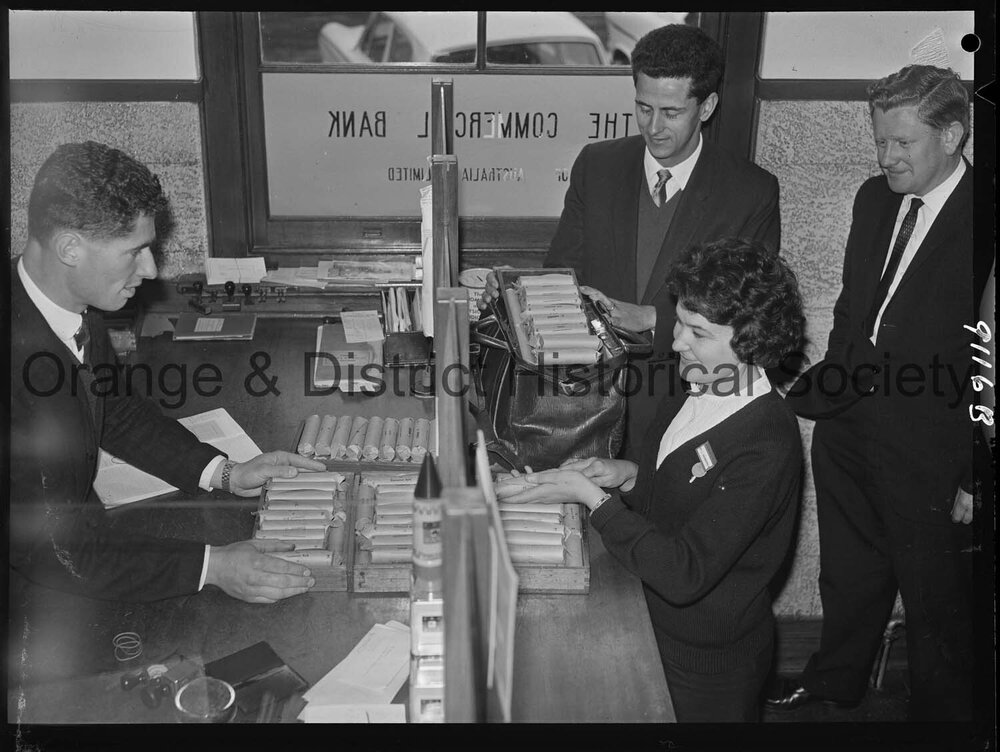 Miss Carol Nonnenmacher banking pennies