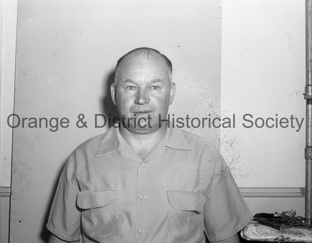 Bill Denman handing present to pensioners