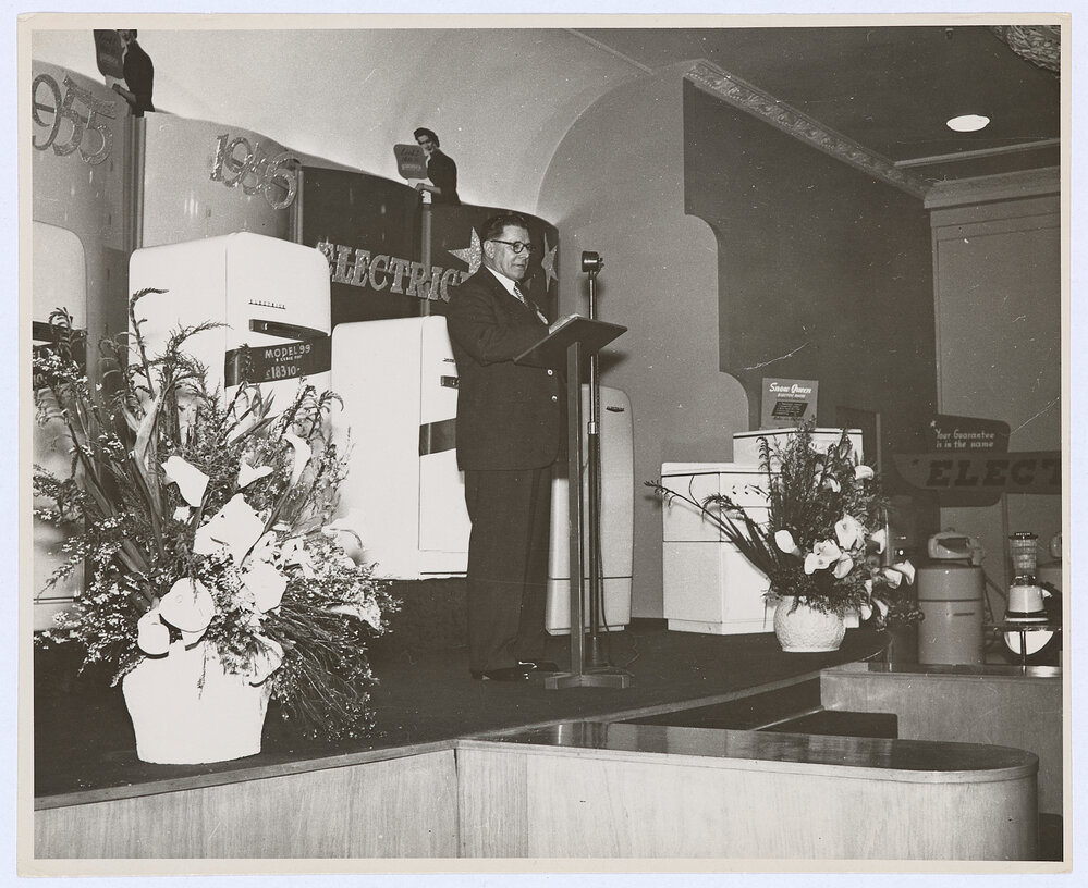 Unidentified man delivering a speech at the Email factory