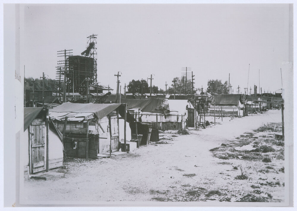 Tent City, adjacent to the Emmco plant, Orange