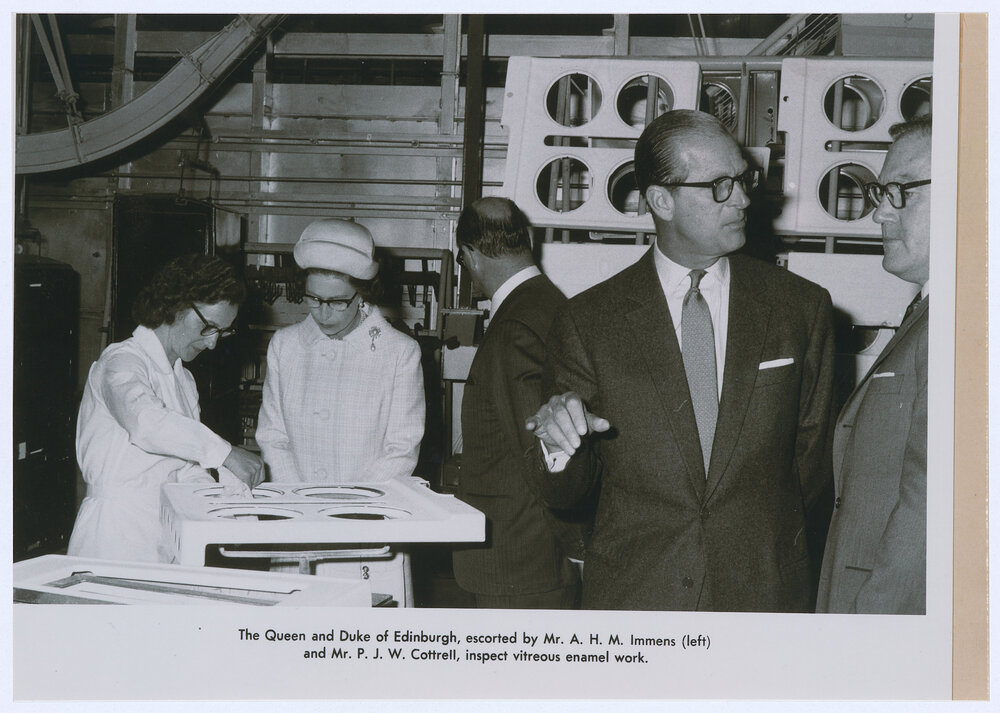 Queen Elizabeth and the Duke of Edinburgh inspect vitreous enamel work at the Email factory, Orange