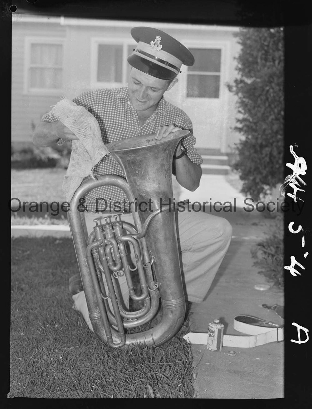 Elwyn McAlister cleaning his tuba