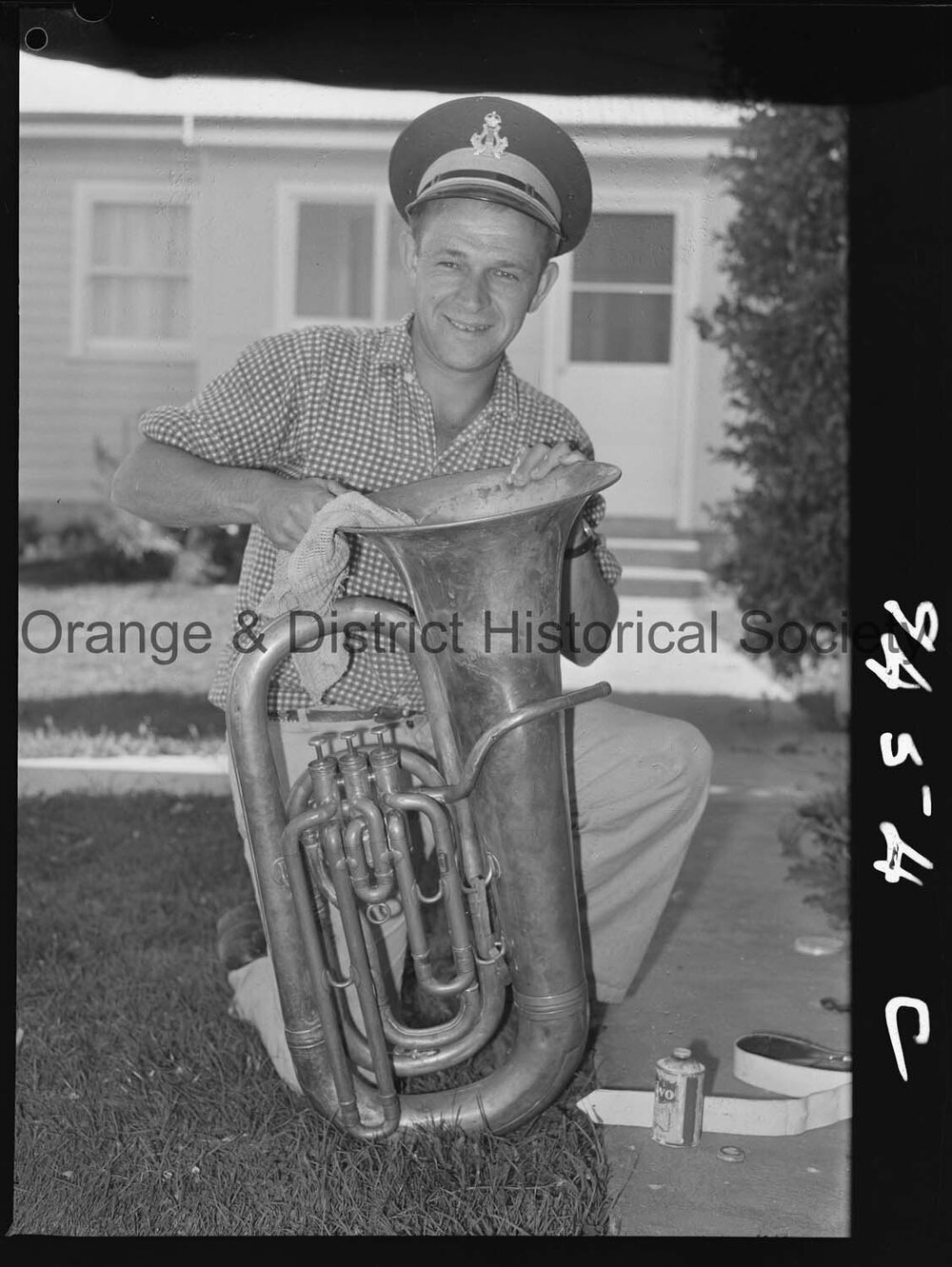 Elwyn McAlister cleaning his tuba