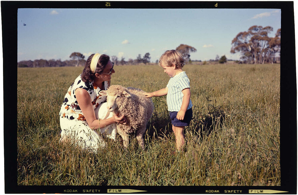 Woman and boy with lamb