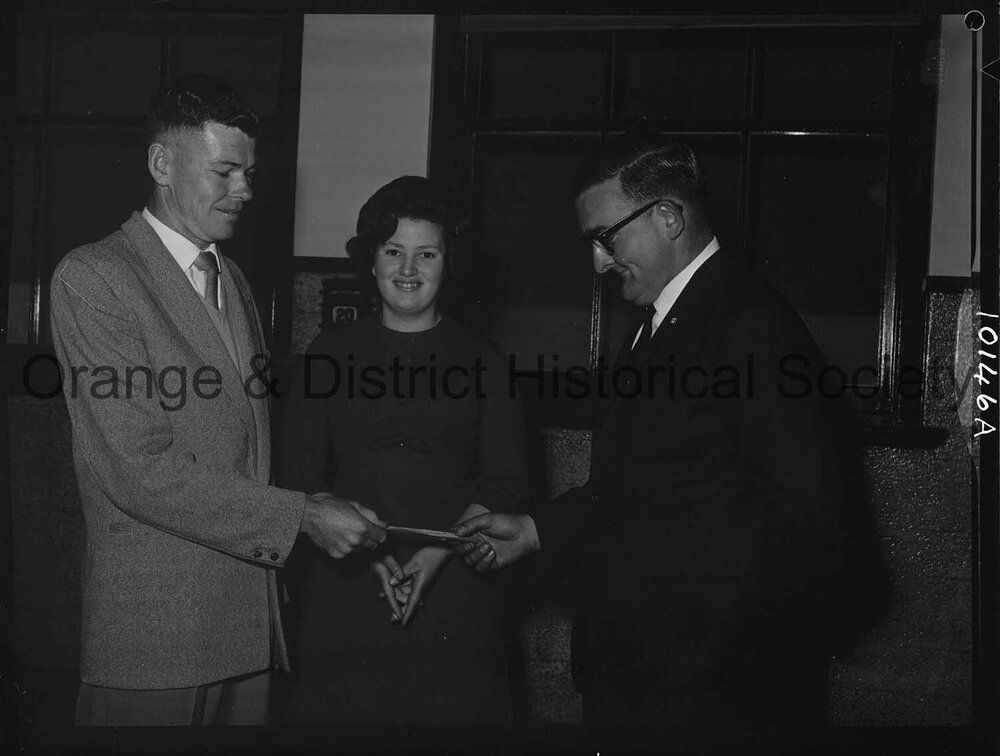 Cherry Blossom Queen candidate watches handover of festival cheque