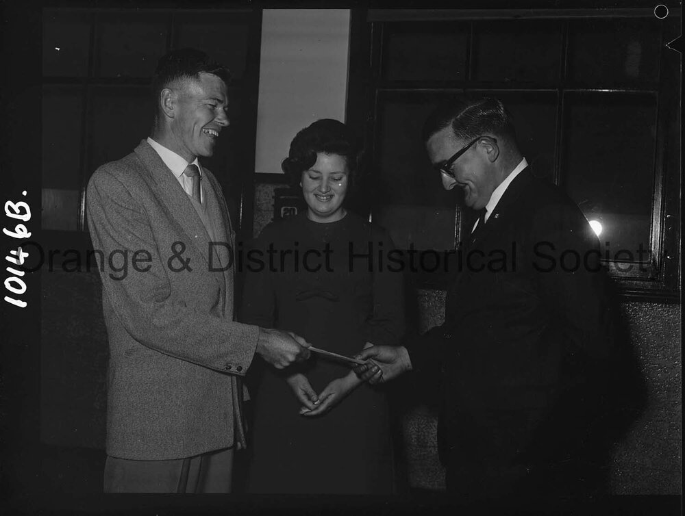 Cherry Blossom Queen candidate watches handover of festival cheque