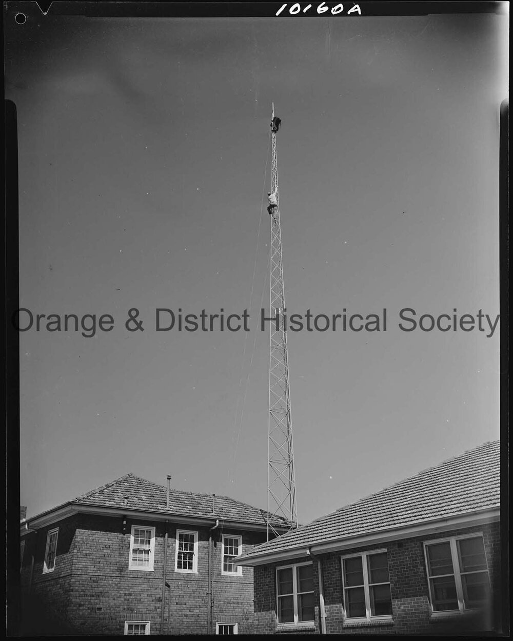 Affix aerial to radio tower at Ambulance Station