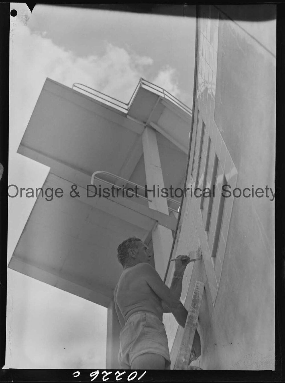 Olympic pool diving board gets a paint over