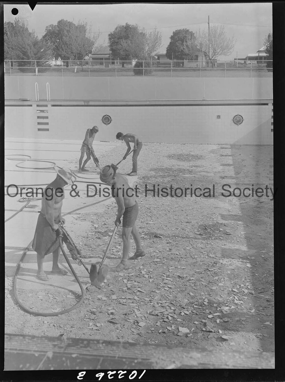 Olympic pool diving board gets a paint over