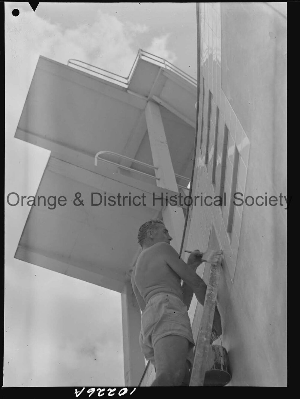 Olympic pool diving board gets a paint over