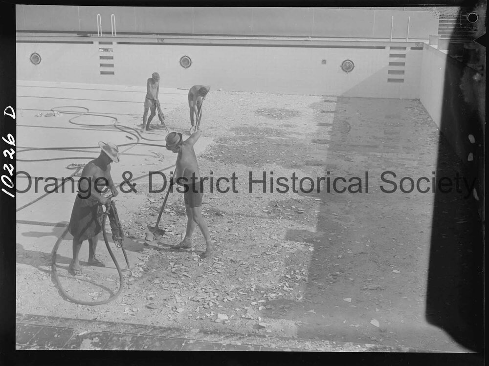 Olympic pool diving board gets a paint over