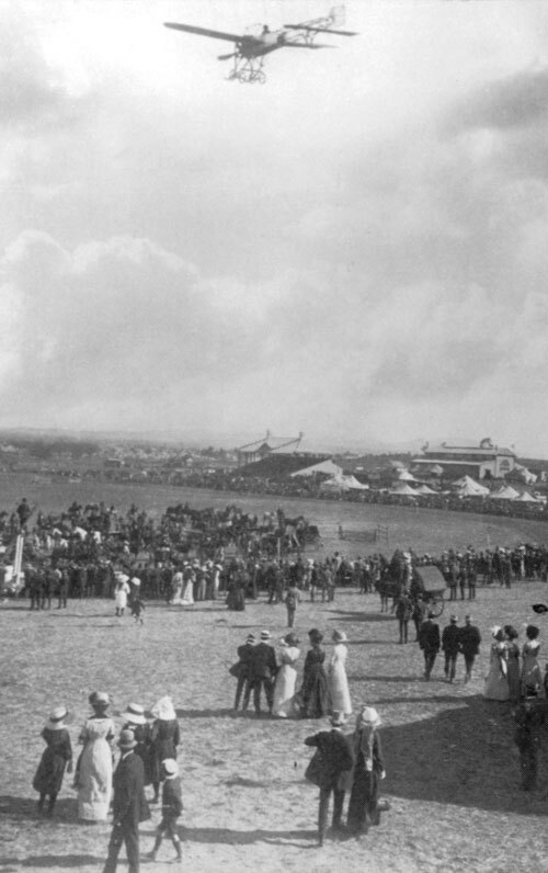 Photographed by W H Bursle a Bleriot type monoplane flying towards centre ring at the 1912 Orange Show