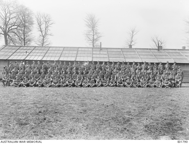 Group portrait of the NCOs of the 45th Battalion, Meteren, France, 6 March 1918.