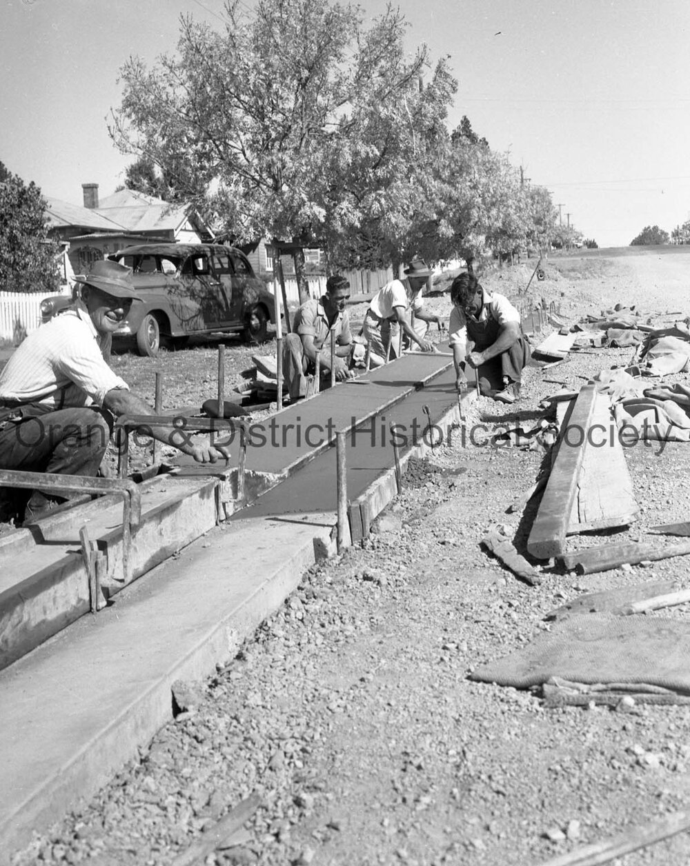 Men working on road in Sampson Street