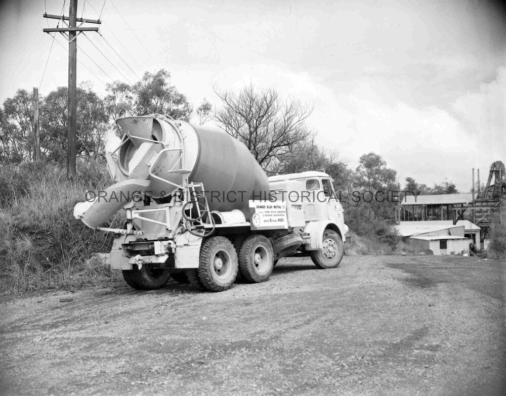 Truck with load of blue metal