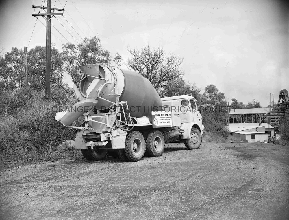 Truck with load of blue metal