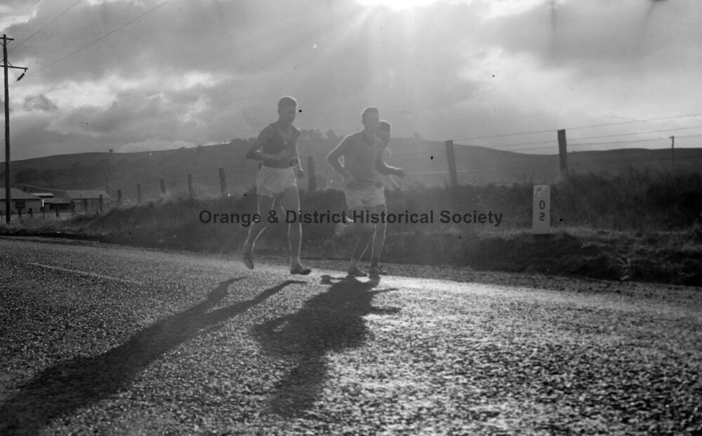 Three men running