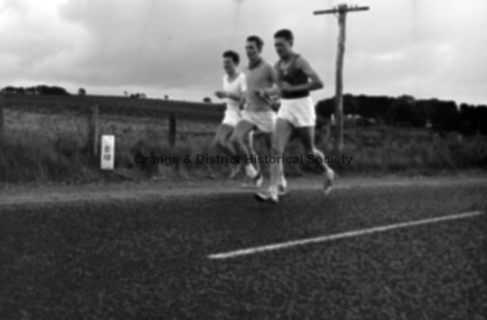 Three men running