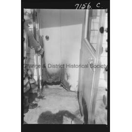 Mrs M Walker shows where vandals broke windows and lit fires at her home
