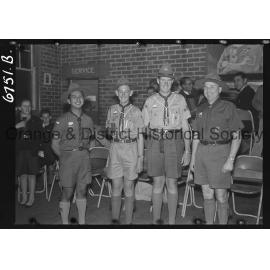 Orange boy scouts awarded with Scout Cords