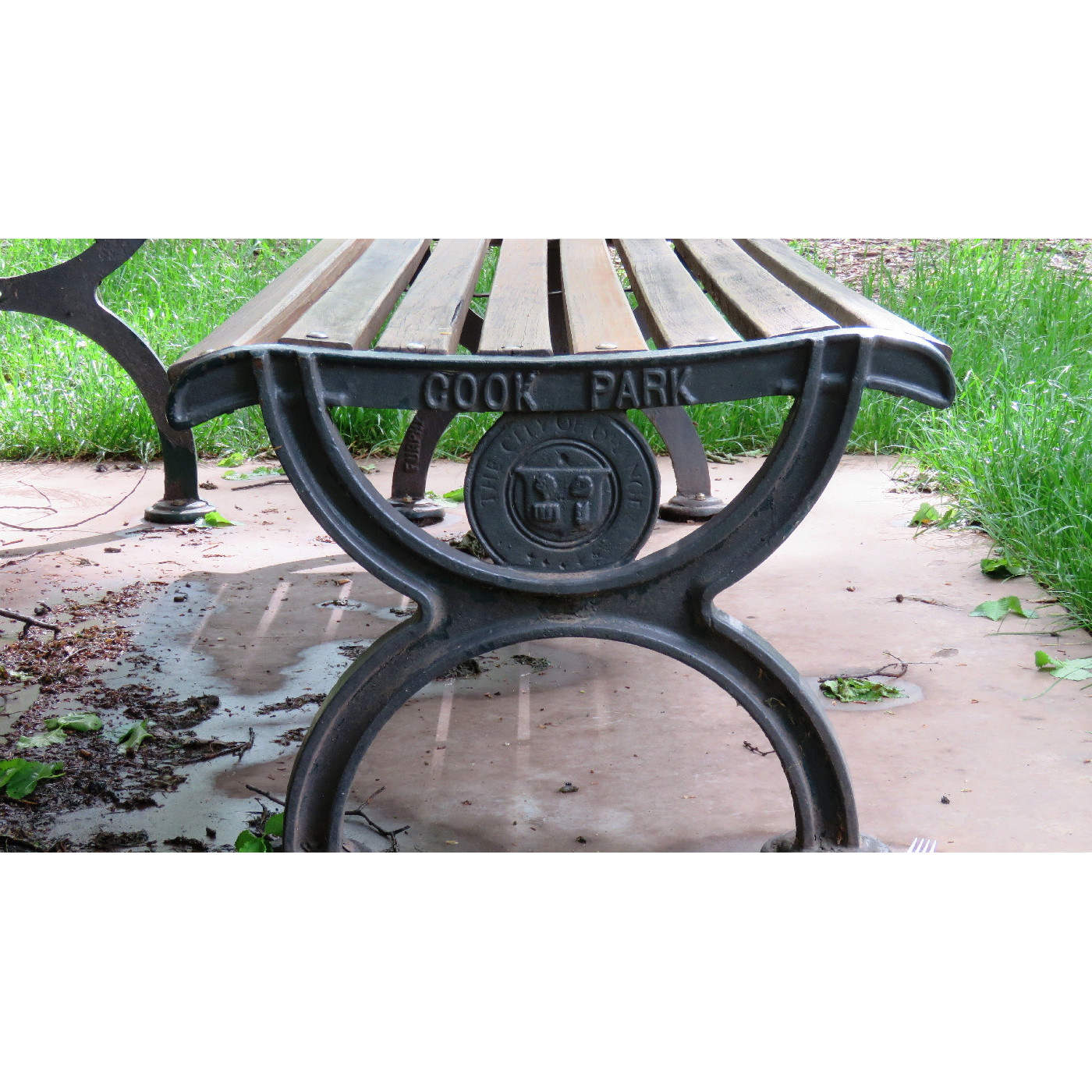 Orange City Council crest on seat in Cook Park, Orange
