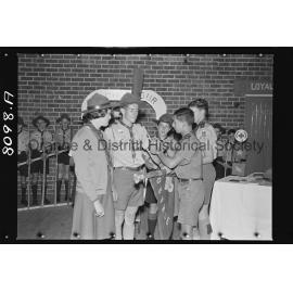 Joan Wheeler receiving Queen's badge for her brother John, who died in the Blue Mountains